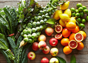 a group of fruits and vegetables on a wood surface Healthy Weight Loss Diets Swansea