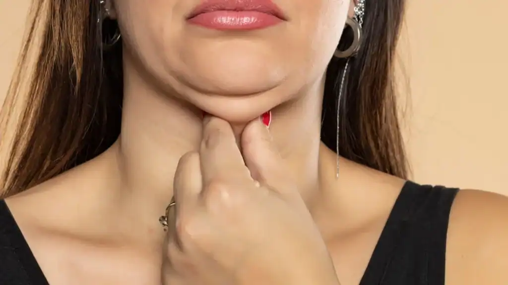 An image of a woman with double chin, sad, worried : Non Surgical Double Chin Removal Treatment in Swansea, UK